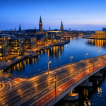 Aerial view of Copenhagen's harborfront and downtown, highlighting transportation infrastructure and contemporary architecture.